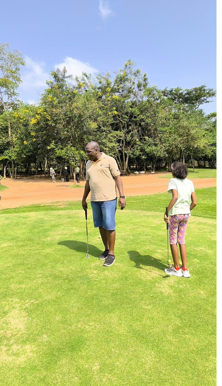 On the golf green with my daughter