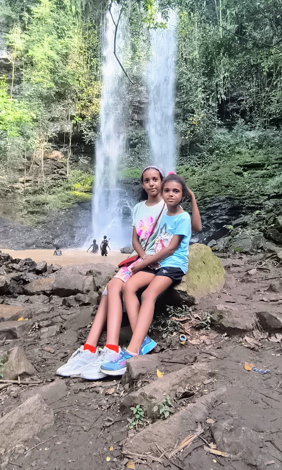 Discovering a waterfall together as a family